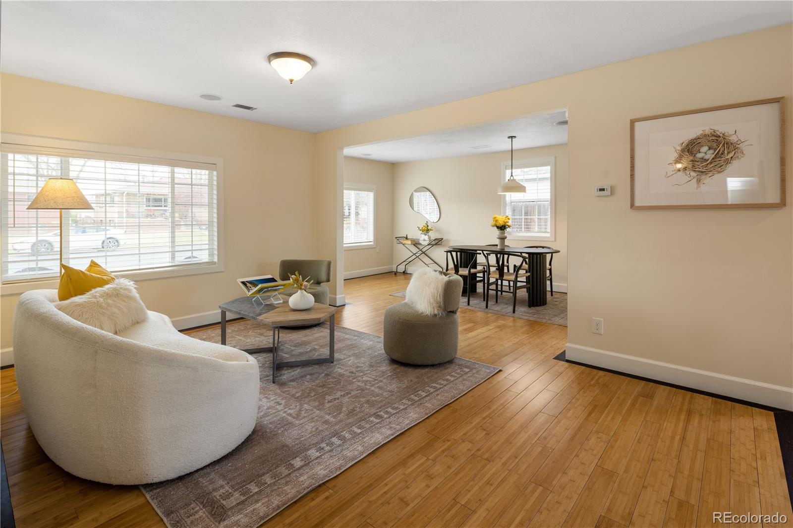 2242 North Lamar Street Edgewater, CO 80214 - Photo 6 of 27 a living room with furniture and a large window