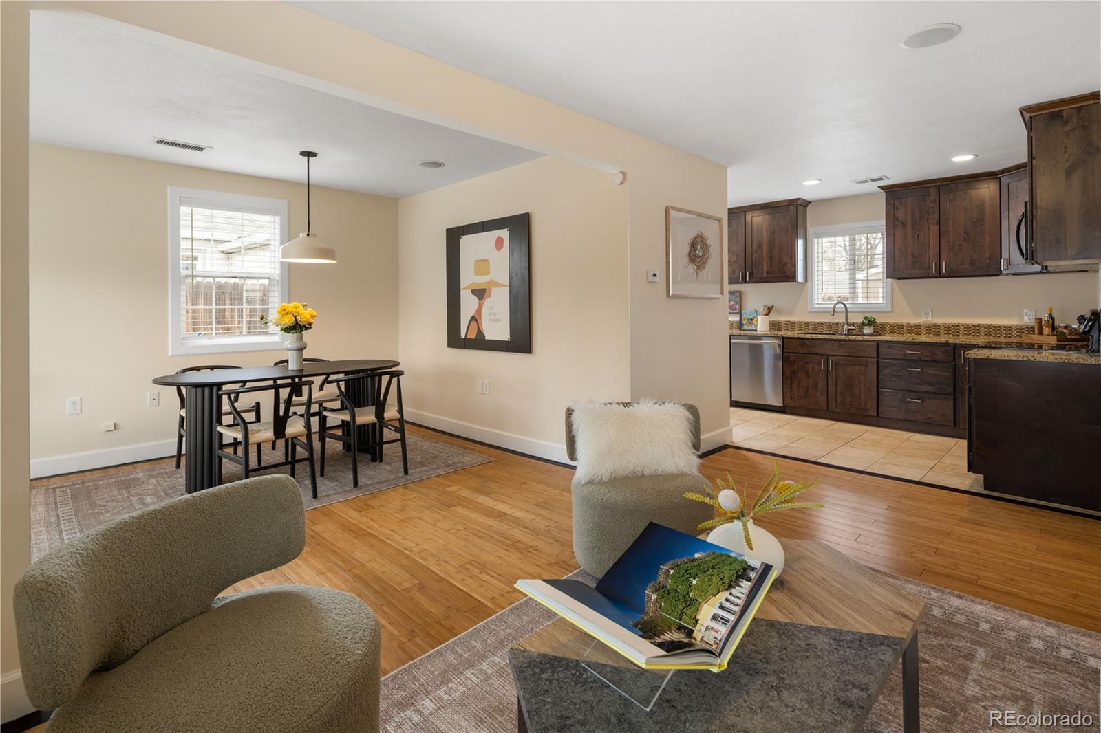 2242 North Lamar Street Edgewater, CO 80214 - Photo 7 of 27 a living room with furniture a dining table and kitchen view