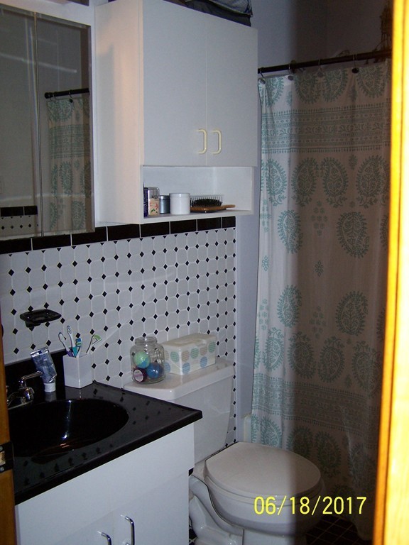 5 Kenmar Drive, Unit 18 Billerica, MA 01821 - Photo 8 of 10 a bathroom with a sink a toilet and shower