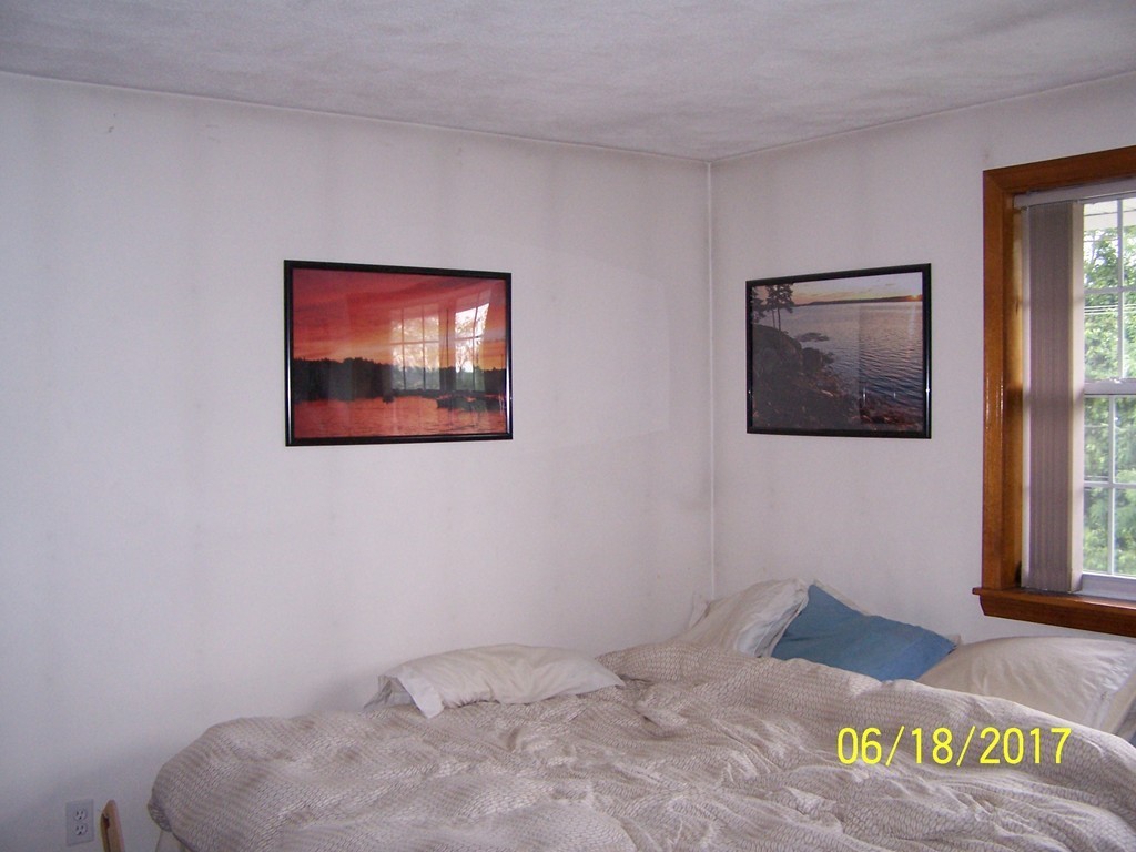 5 Kenmar Drive, Unit 18 Billerica, MA 01821 - Photo 10 of 10 a bedroom with a bed and a window