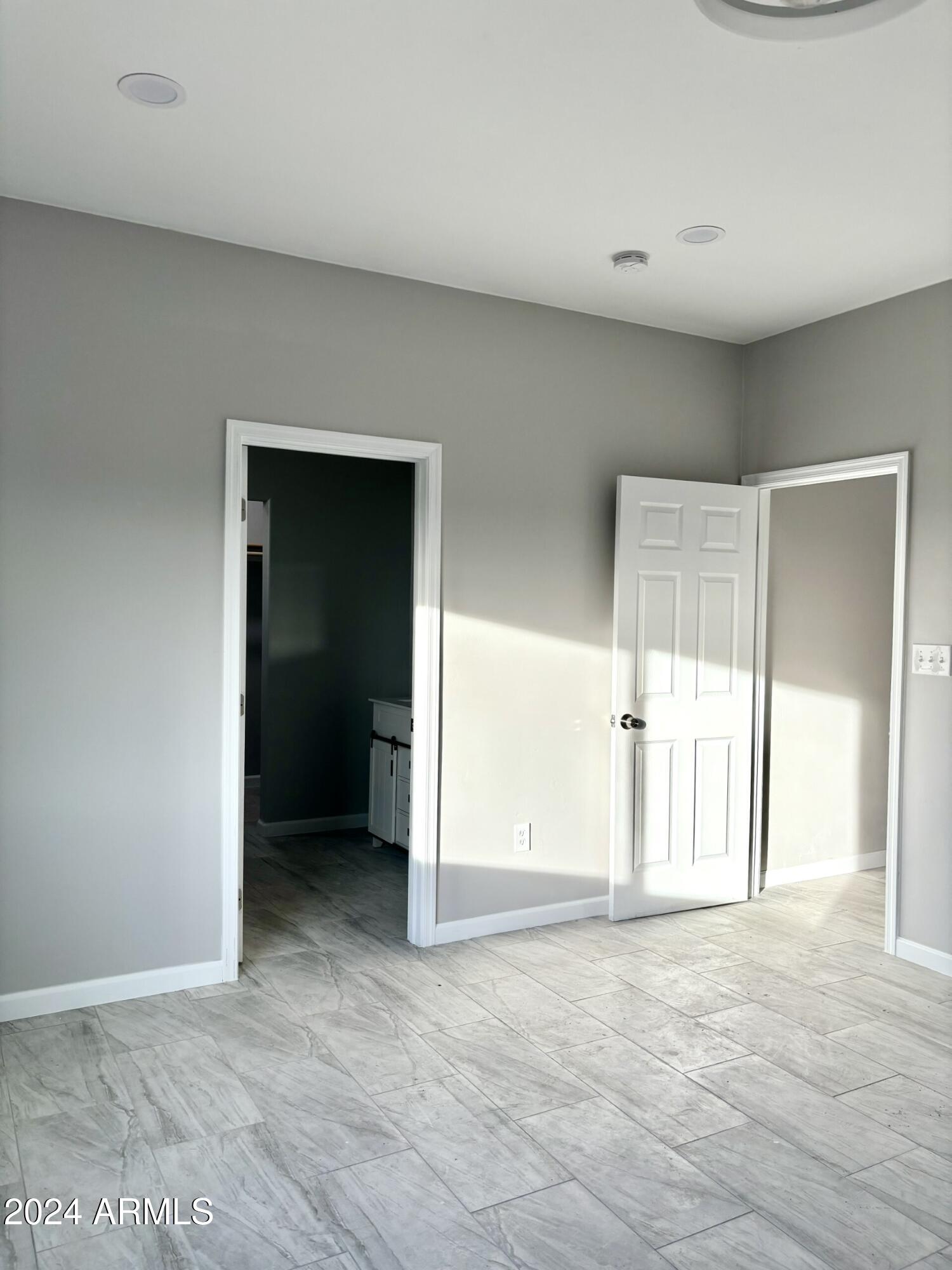3440 Camino Del Rancho Douglas, AZ 85607 - Photo 10 of 14 an empty room with windows and closet