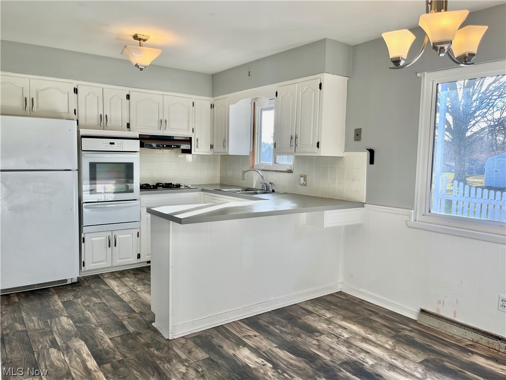 1630 Raber Road Uniontown, OH 44685 - Photo 8 of 31 SPACIOUS KITCHEN WITH WRAP-AROUND COUNTER TOPS, AND BUILT-IN OVEN. PLENTY OF NATURAL LIGHT! APPLIANCES INCLUDED!