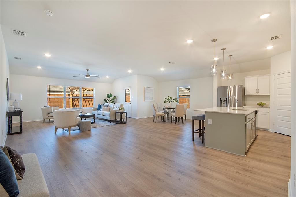 544 Hickory Rdg Drive Van Alstyne, TX 75495 - Photo 13 of 30 a view of a living room kitchen with furniture and wooden floor