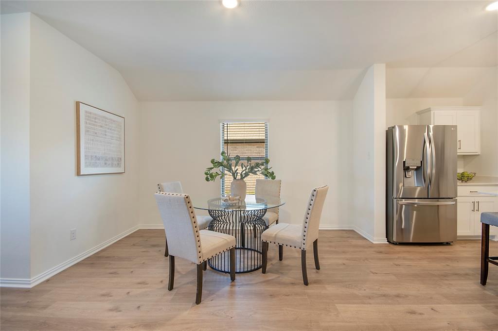 544 Hickory Rdg Drive Van Alstyne, TX 75495 - Photo 15 of 30 a dining room with furniture and a refrigerator