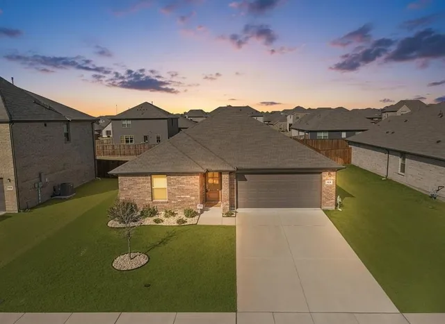 a view of a big house with a big yard