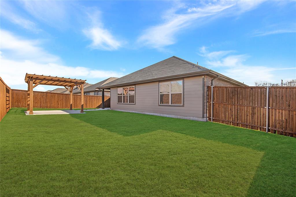 544 Hickory Rdg Drive Van Alstyne, TX 75495 - Photo 26 of 30 a view of a house with backyard and garden