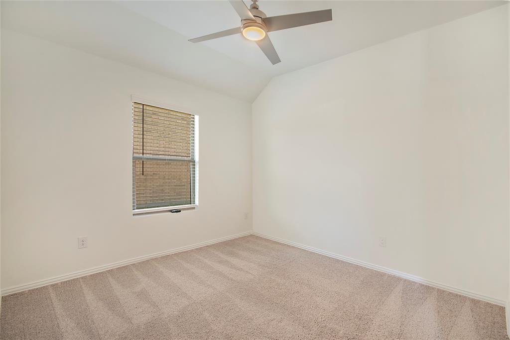 544 Hickory Rdg Drive Van Alstyne, TX 75495 - Photo 7 of 30 an empty room with a window and a fan