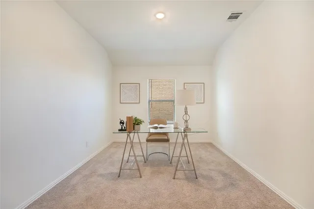 a workspace with furniture and window