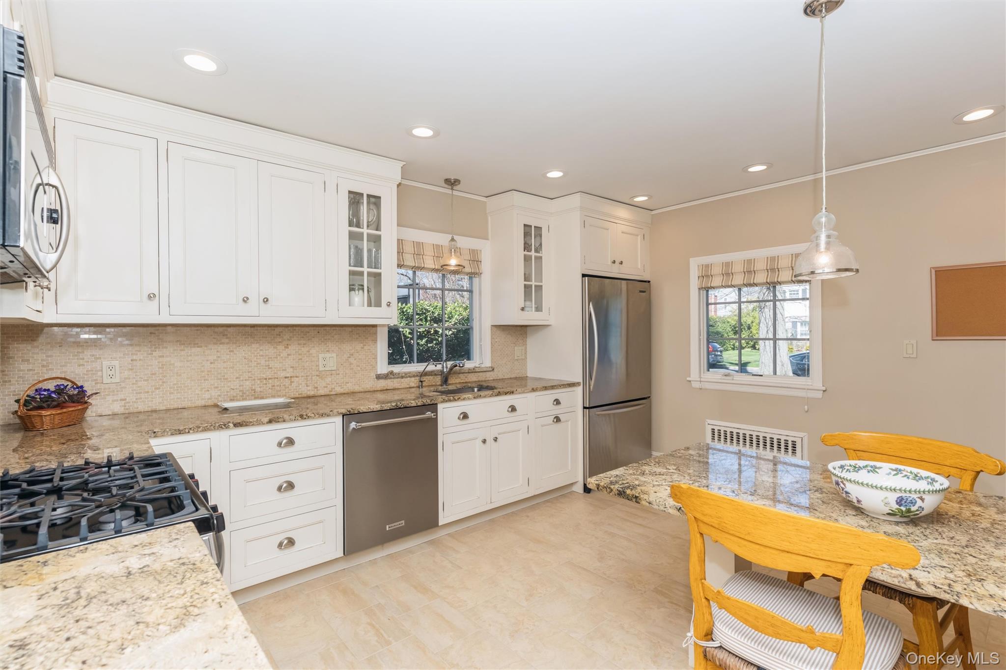 46 Wyatt Road Garden City, NY 11530 - Photo 12 of 32 a kitchen with a sink stove and window