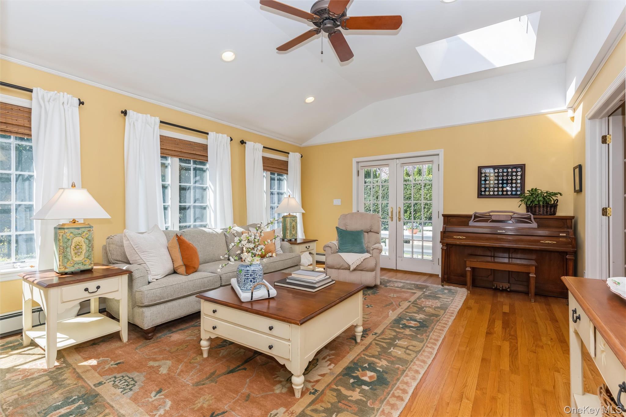 46 Wyatt Road Garden City, NY 11530 - Photo 15 of 32 a living room with furniture and a table