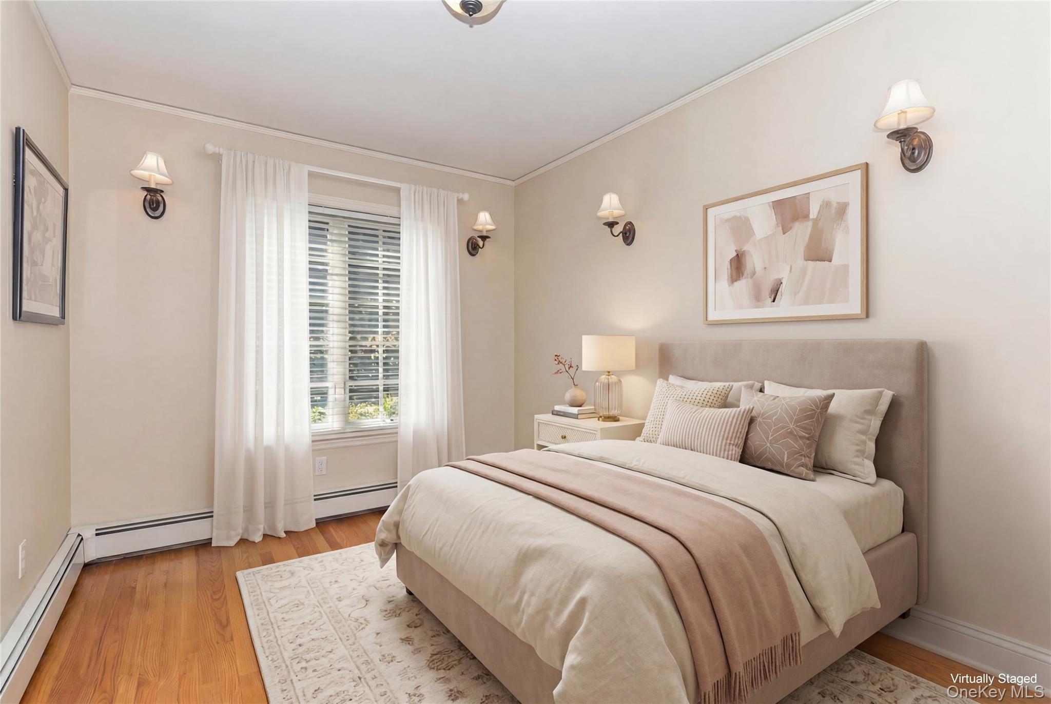 46 Wyatt Road Garden City, NY 11530 - Photo 16 of 32 a bedroom with a bed and a window