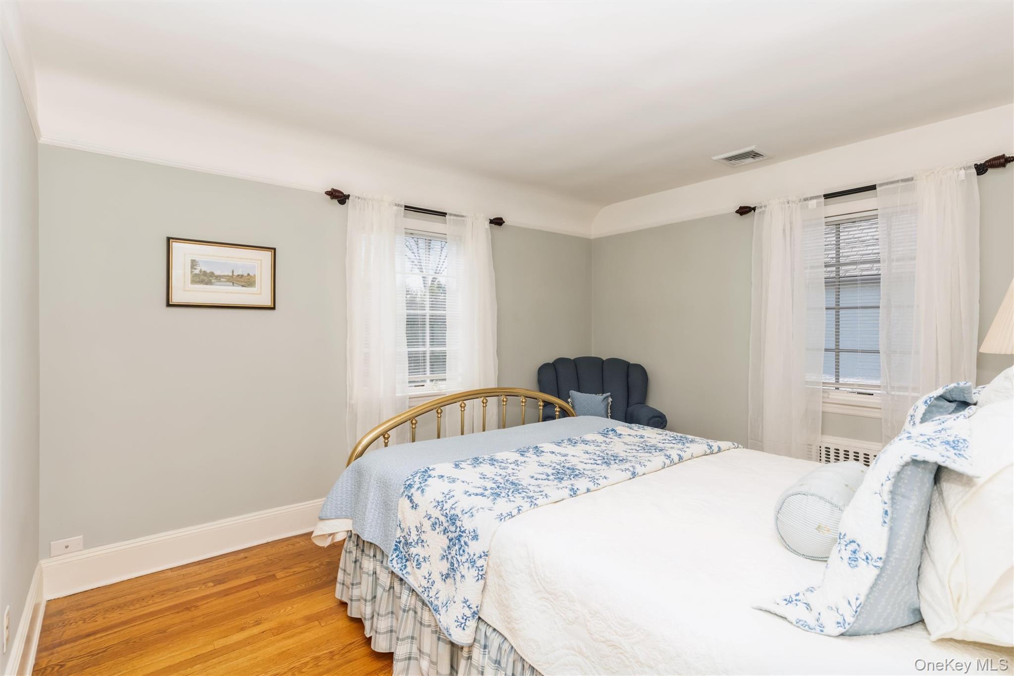 46 Wyatt Road Garden City, NY 11530 - Photo 24 of 32 a bedroom with a bed and a window