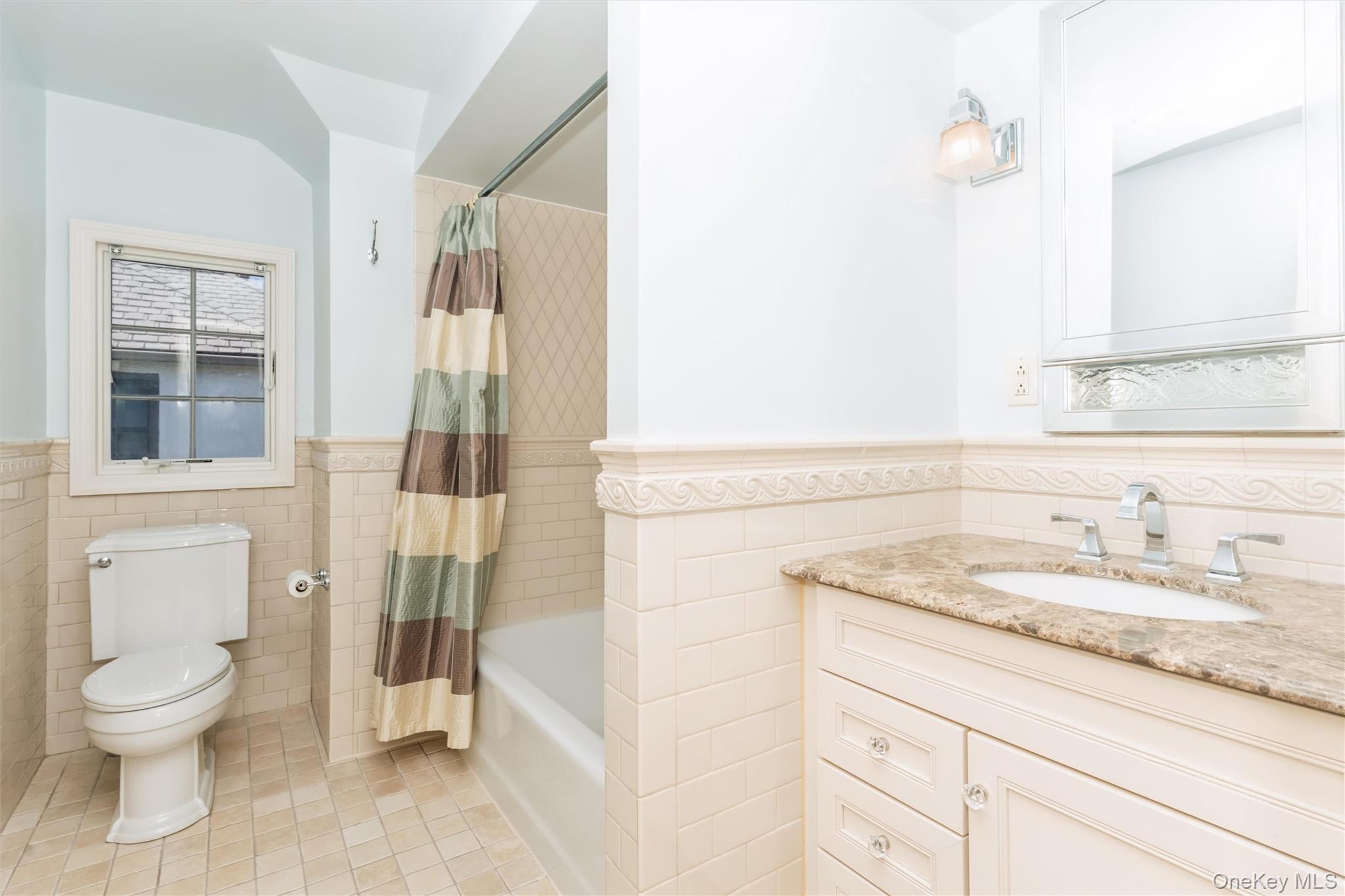 46 Wyatt Road Garden City, NY 11530 - Photo 25 of 32 a bathroom with a granite countertop sink toilet and shower