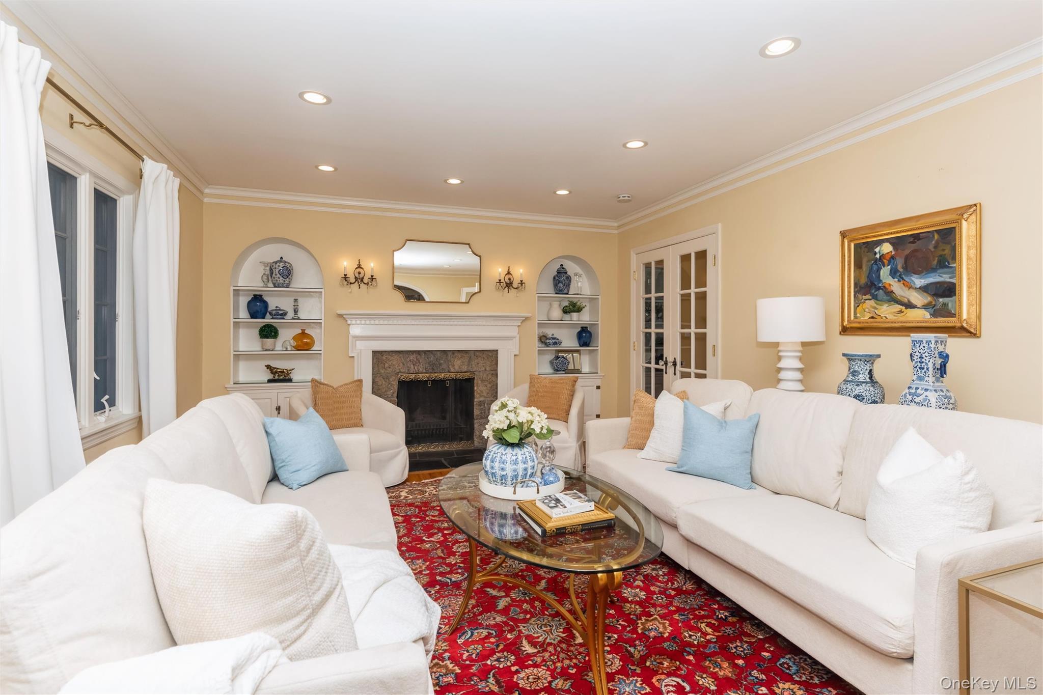 46 Wyatt Road Garden City, NY 11530 - Photo 6 of 32 a living room with furniture fireplace and a window