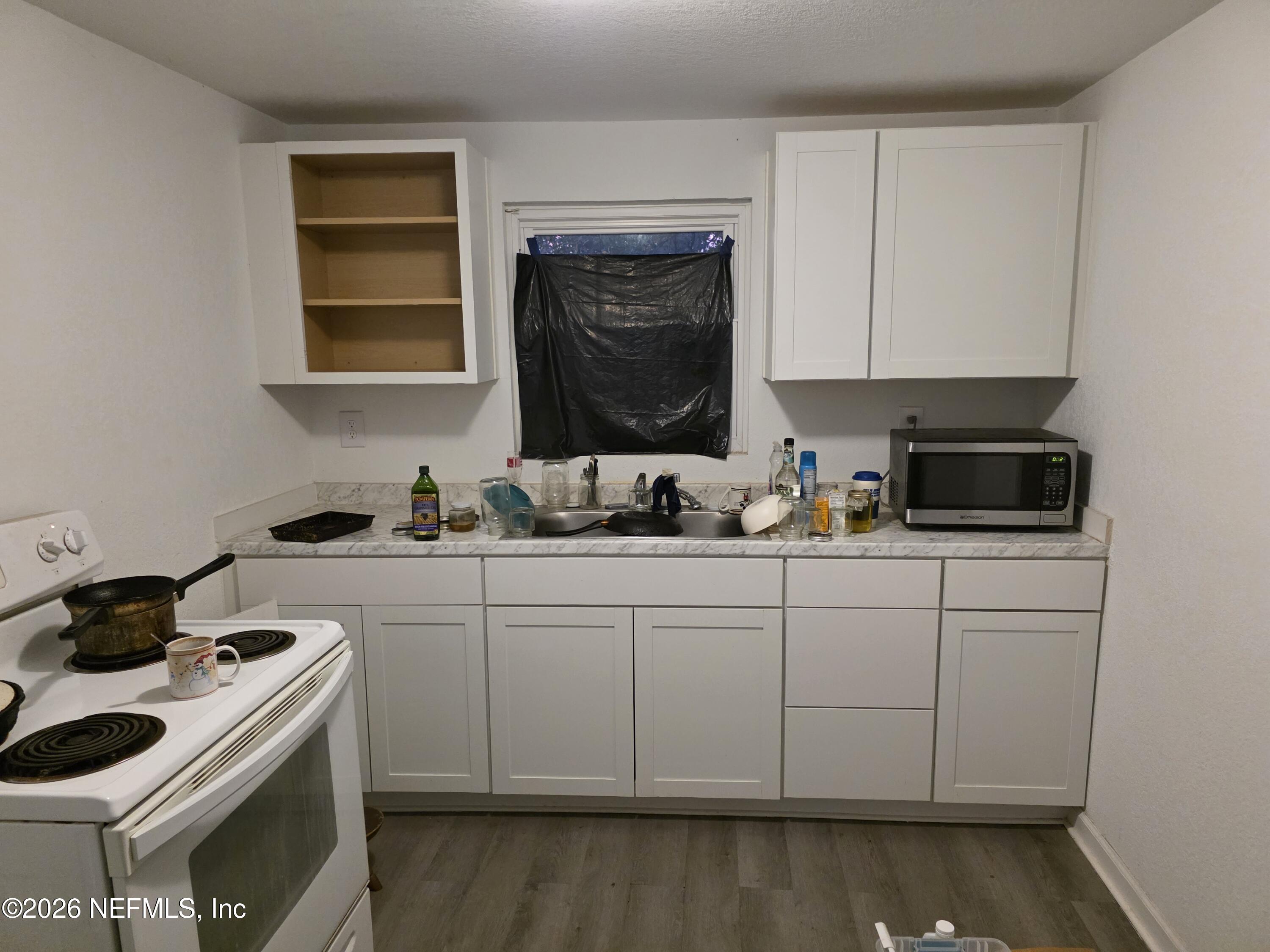 1949 West 6th Street Jacksonville, FL 32209 - Photo 11 of 15 a kitchen with a sink and cabinets