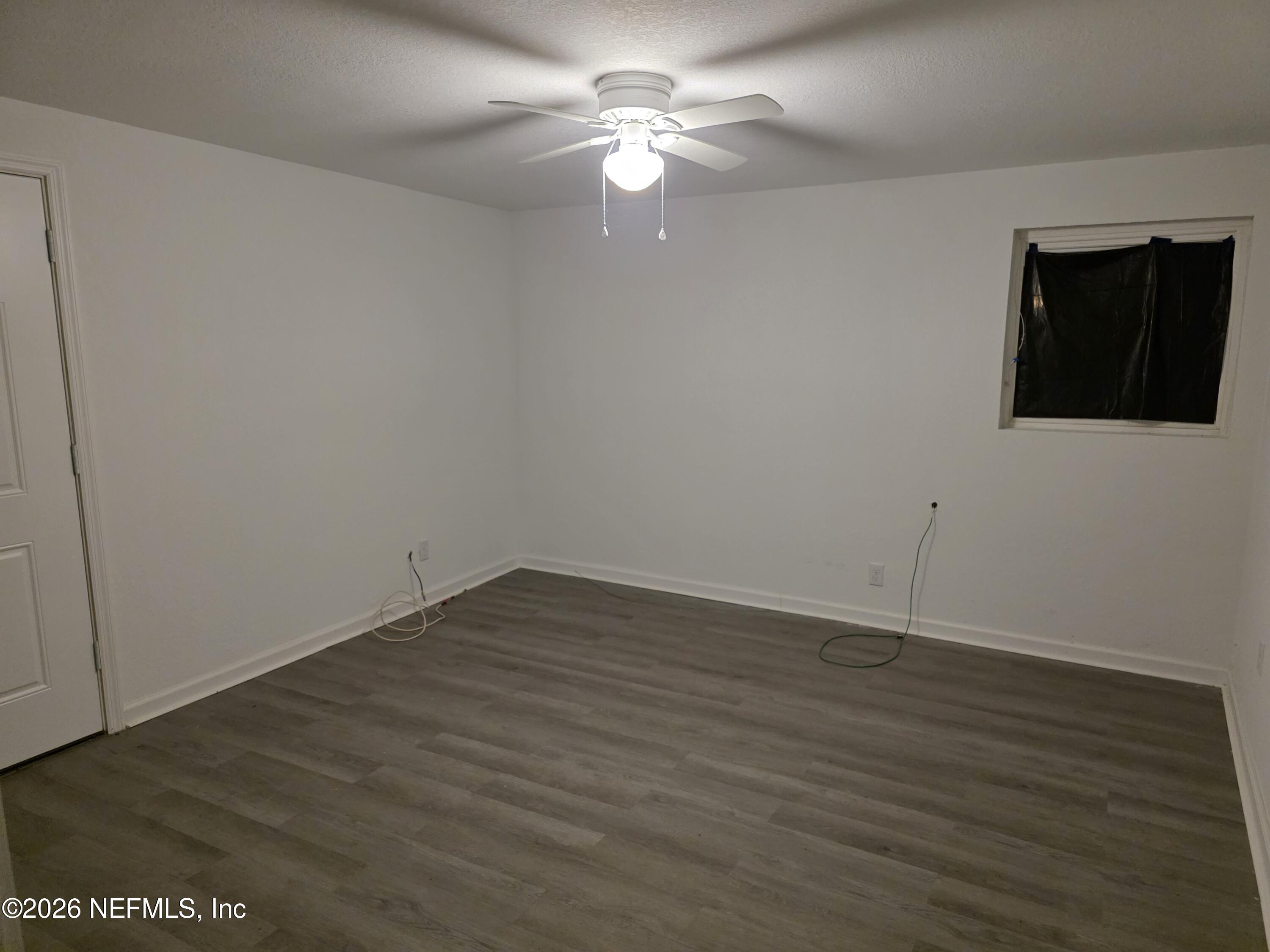 1949 West 6th Street Jacksonville, FL 32209 - Photo 13 of 15 a view of a room with wooden floor and a ceiling fan