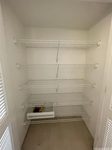 a bathroom with a window and a shower