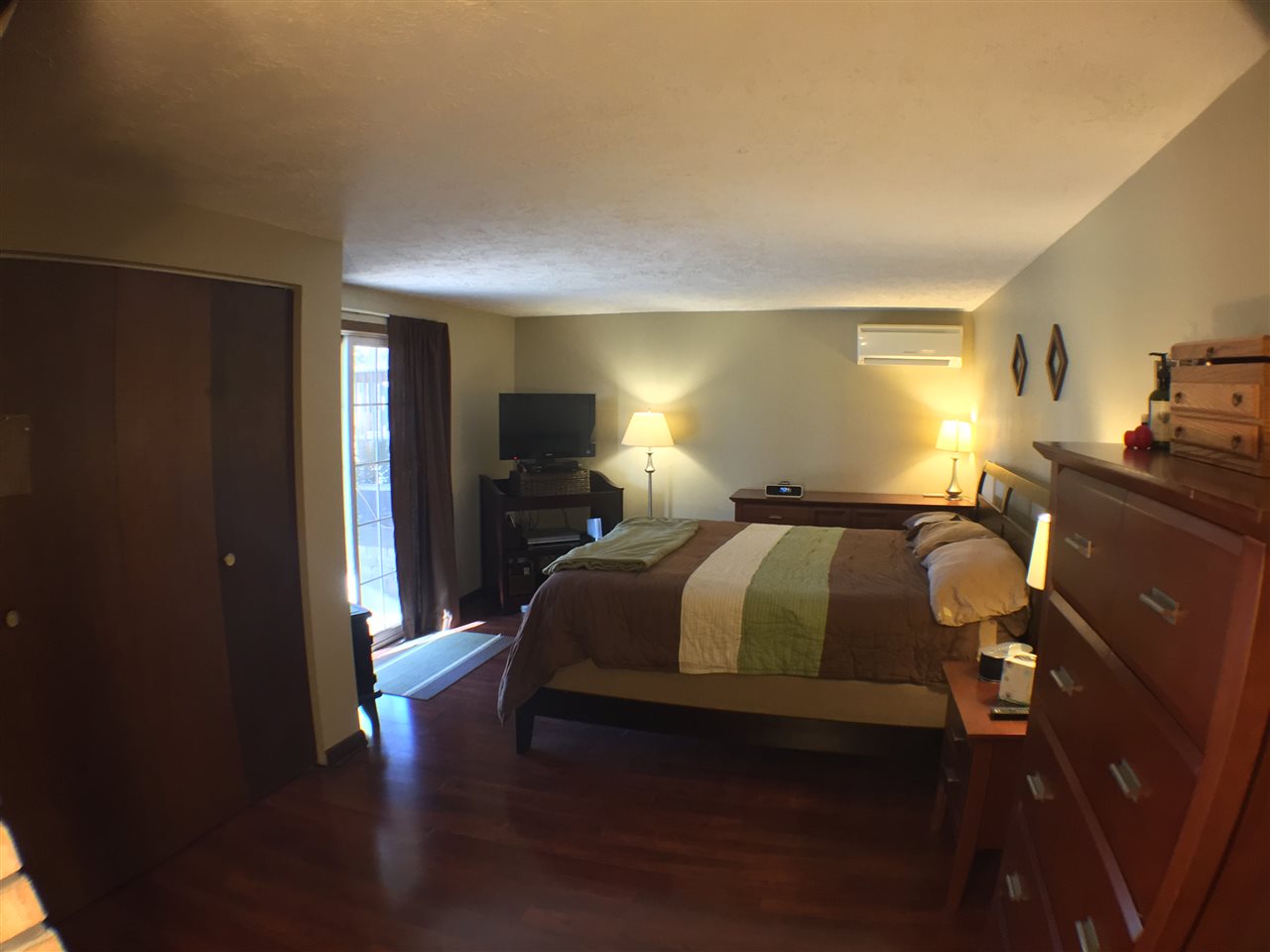 11578 Comly Rd. Winnebago, IL 61088 - Photo 13 of 23 a bedroom with a bed and wooden floor