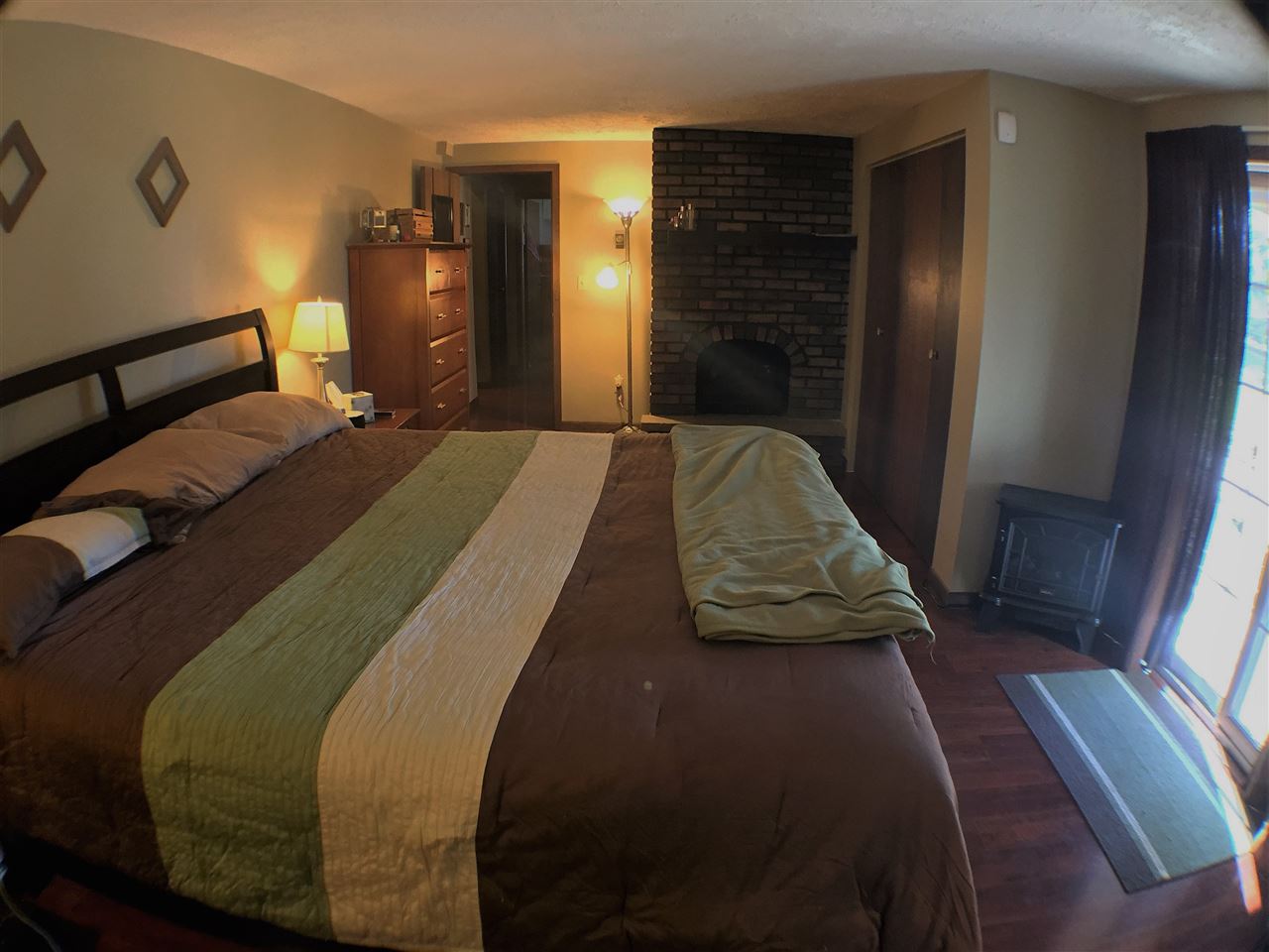 11578 Comly Rd. Winnebago, IL 61088 - Photo 14 of 23 a bedroom with a bed and a mirror