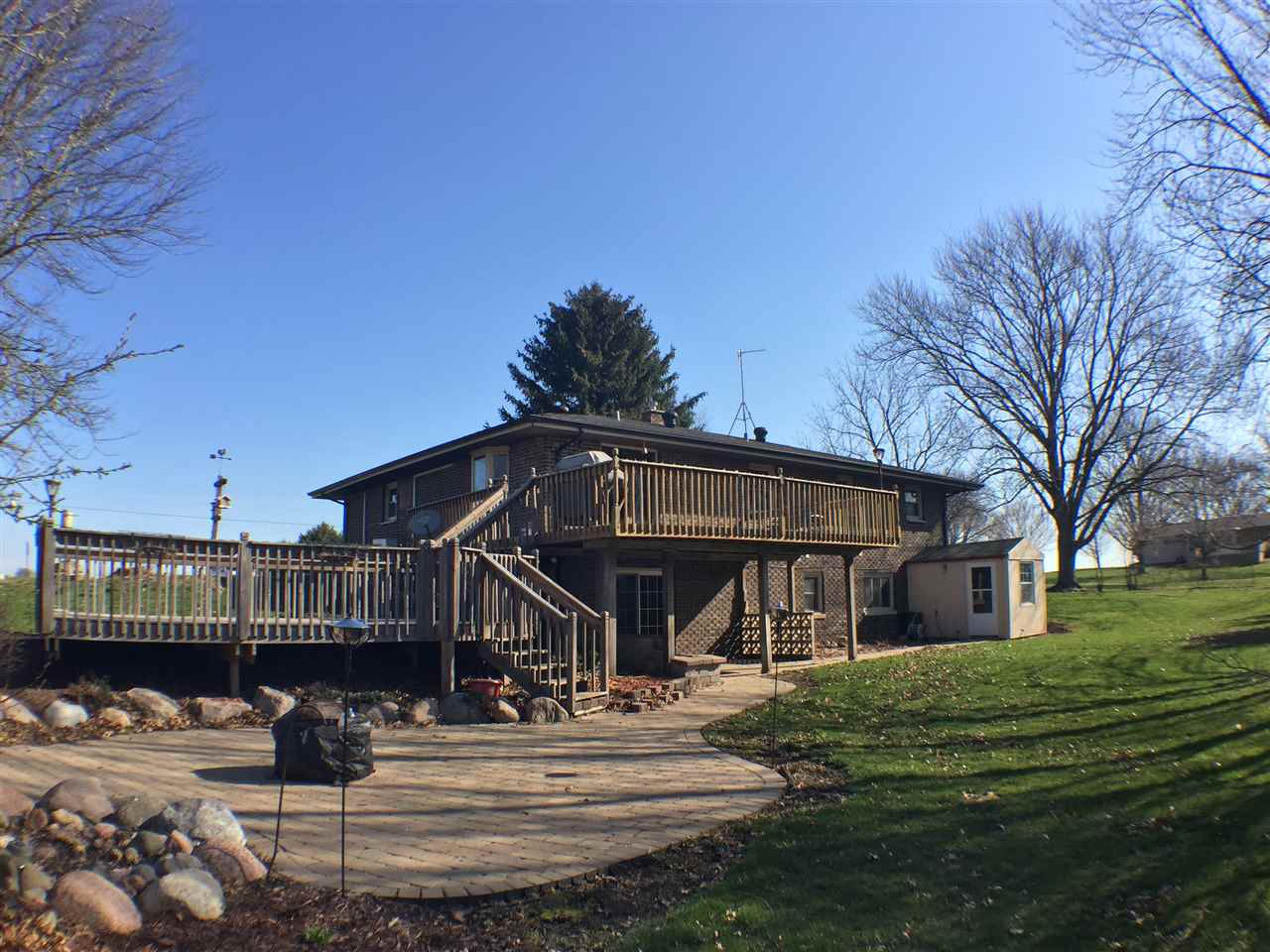 11578 Comly Rd. Winnebago, IL 61088 - Photo 16 of 23 a view of a house with a yard