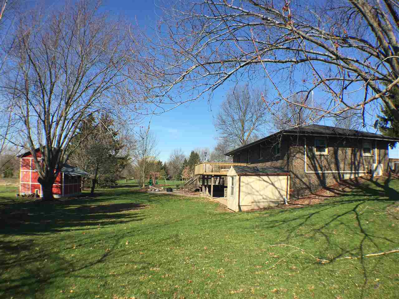 11578 Comly Rd. Winnebago, IL 61088 - Photo 17 of 23 a view of a house with a yard