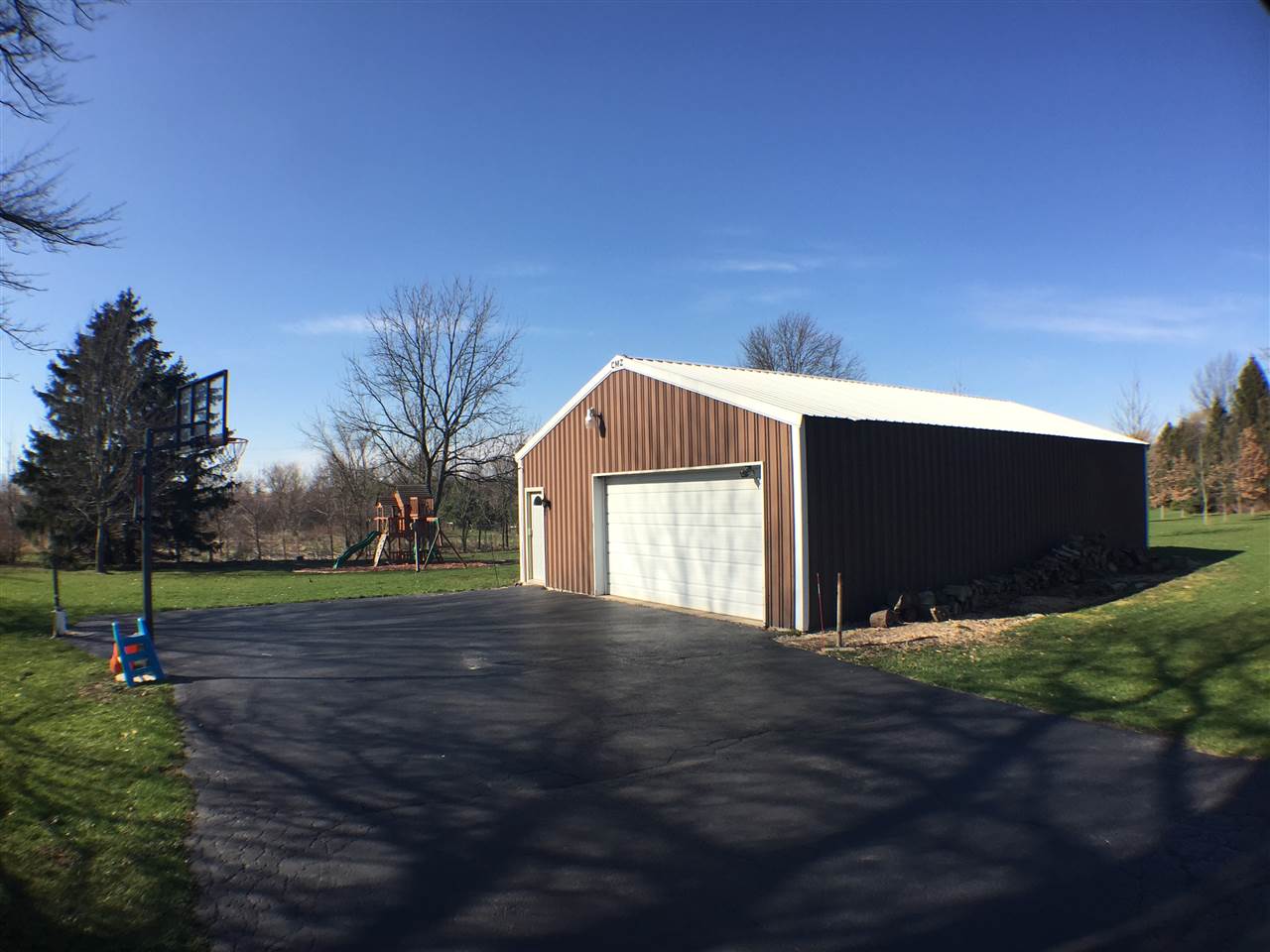 11578 Comly Rd. Winnebago, IL 61088 - Photo 18 of 23 a house view with garden space