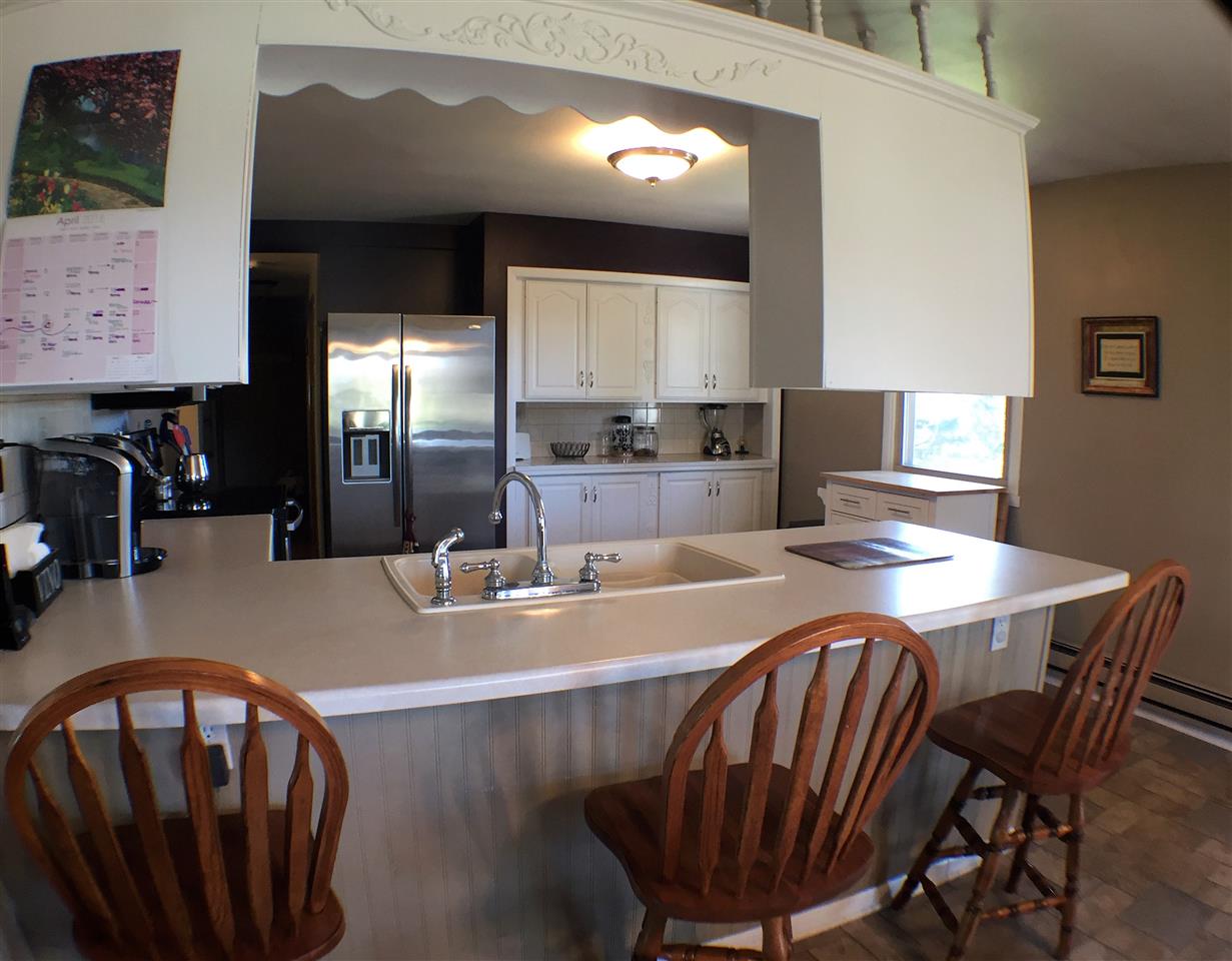 11578 Comly Rd. Winnebago, IL 61088 - Photo 6 of 23 a dining room with furniture and a chandelier