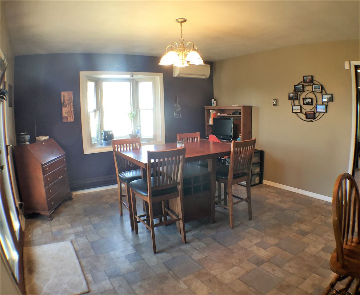 11578 Comly Rd. Winnebago, IL 61088 - Photo 8 of 23 a dining room with furniture and window