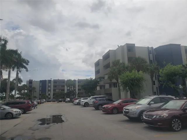 a view of a street with cars