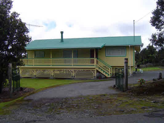 11-3220 Volcano Road Volcano, HI 96771 - Photo 6 of 8 a front view of a house with a yard
