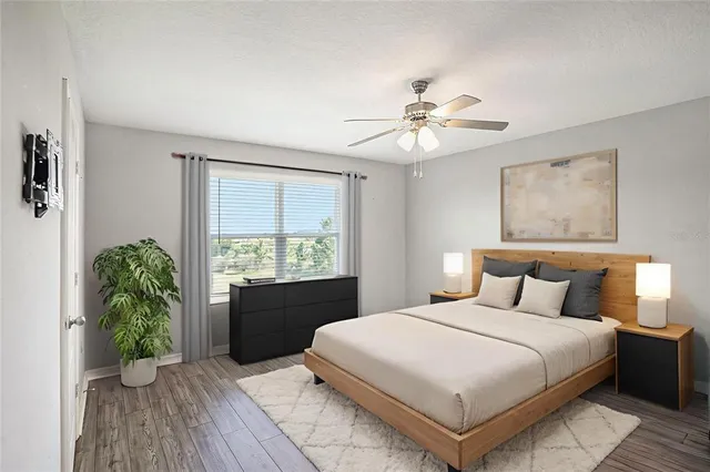 a bedroom with a large bed and a window