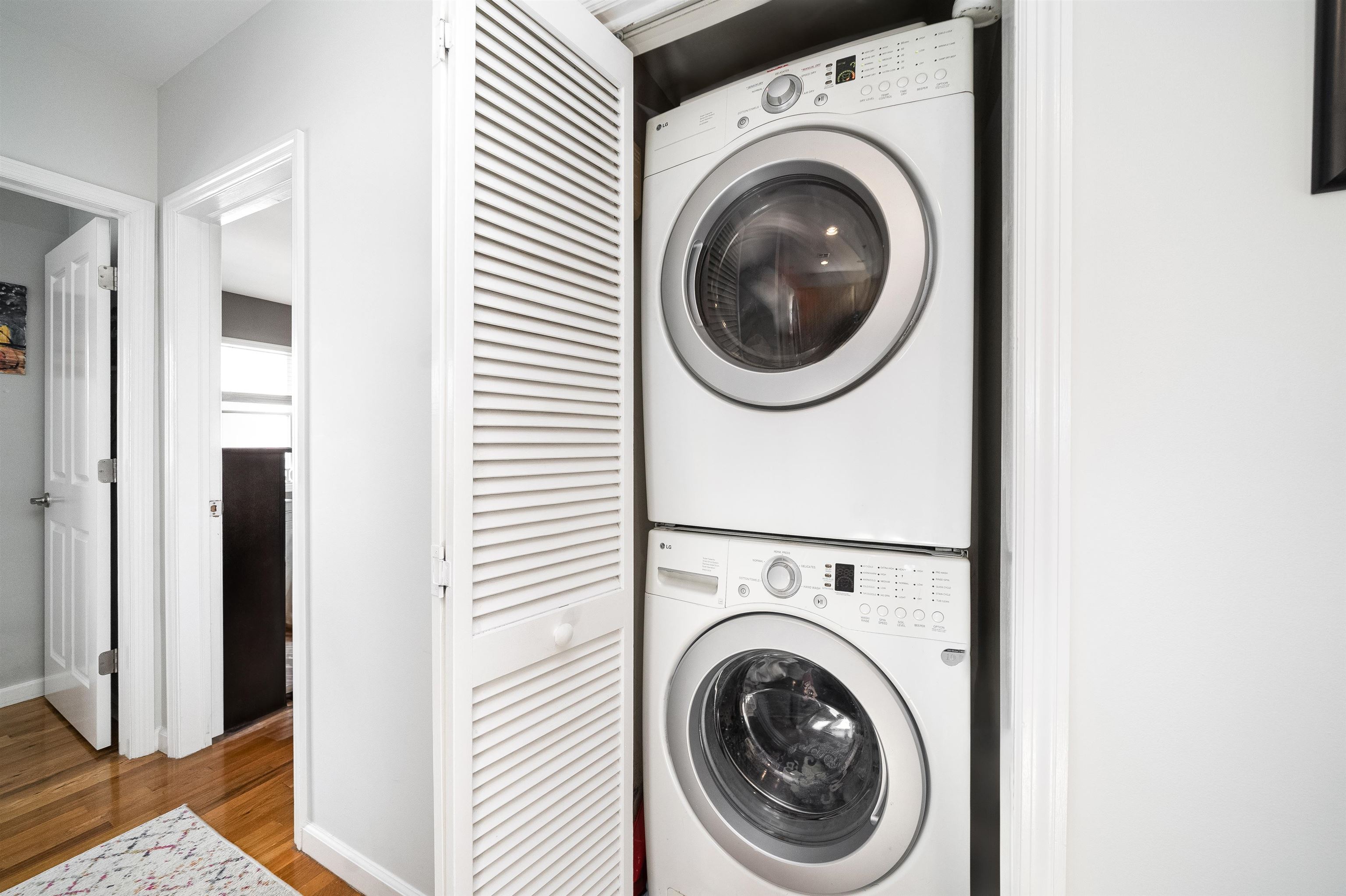536 Grand Street, Unit 403 Hoboken, NJ 07030 - Photo 12 of 15 a view of a hallway with washer and dryer