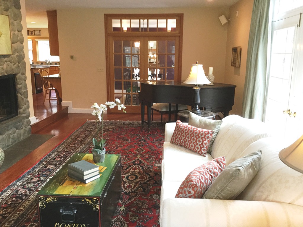 2 Ryer Lane Middleton, MA 01949 - Photo 4 of 16 a living room with furniture and a large mirror