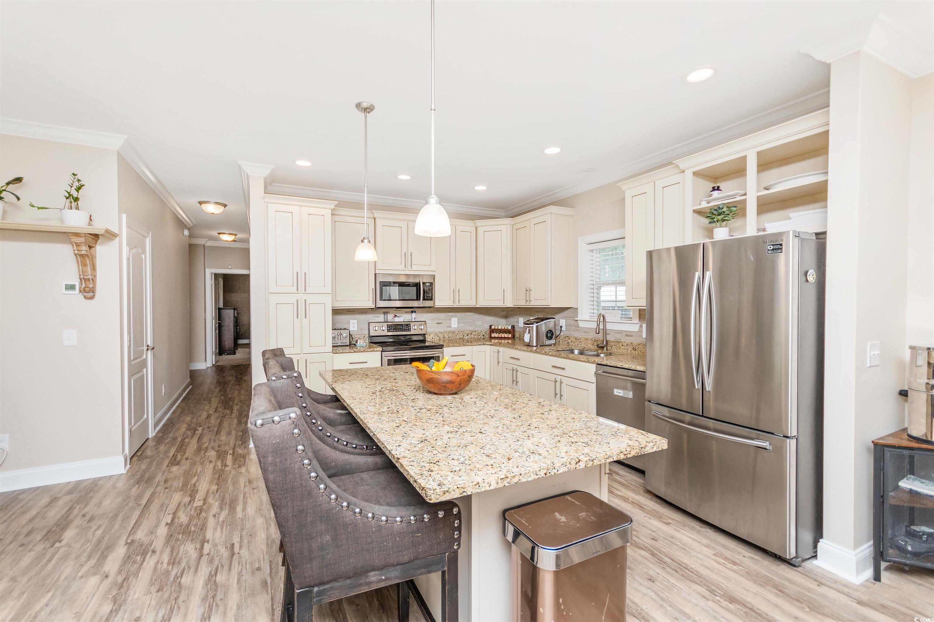 510 Council Bluff Road Longs, SC 29568 - Photo 11 of 40 Kitchen with a kitchen breakfast bar, light stone