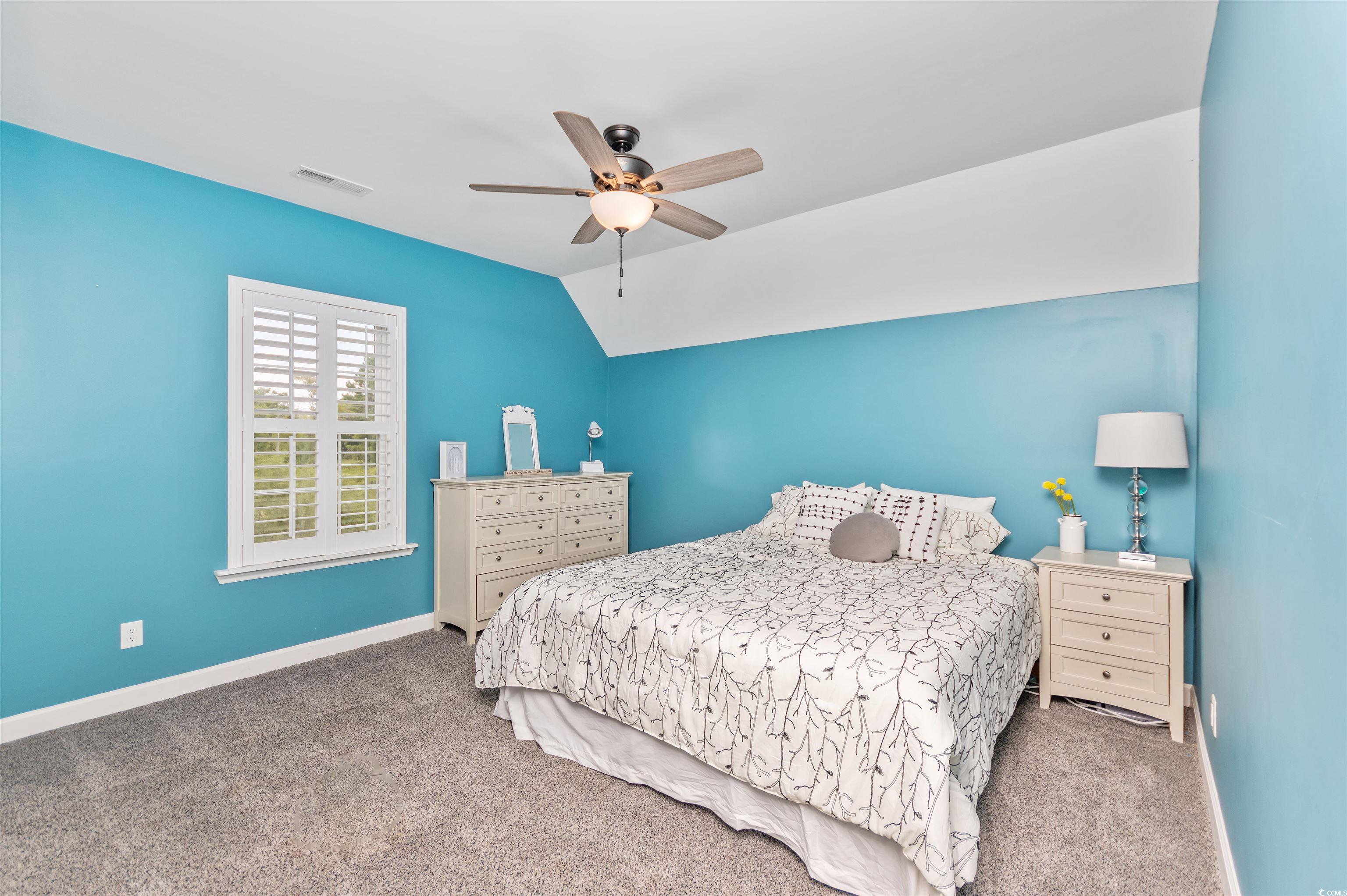 510 Council Bluff Road Longs, SC 29568 - Photo 23 of 40 Carpeted bedroom with ceiling fan and lofted ceili