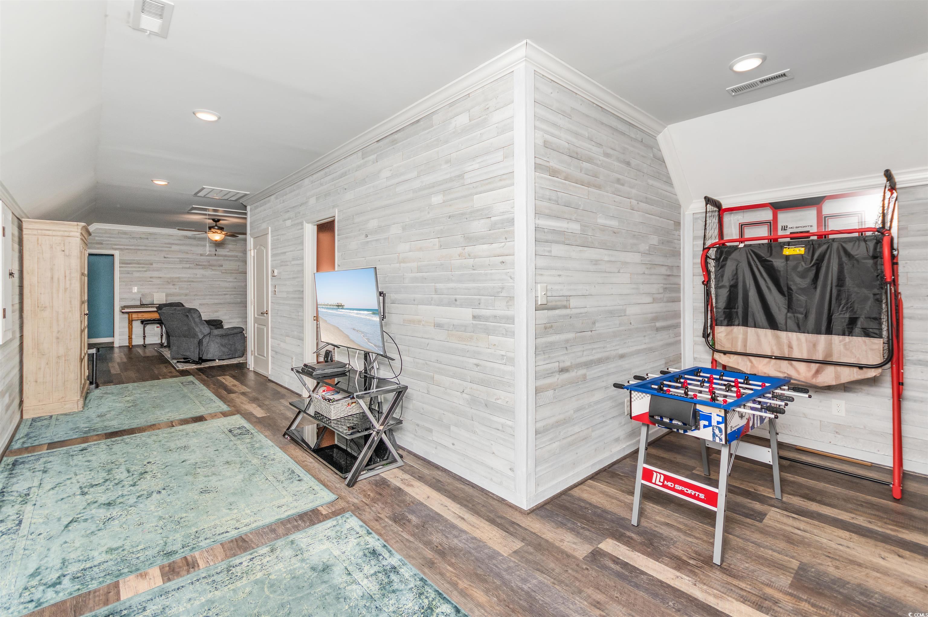 510 Council Bluff Road Longs, SC 29568 - Photo 26 of 40 Interior space with crown molding, dark hardwood /