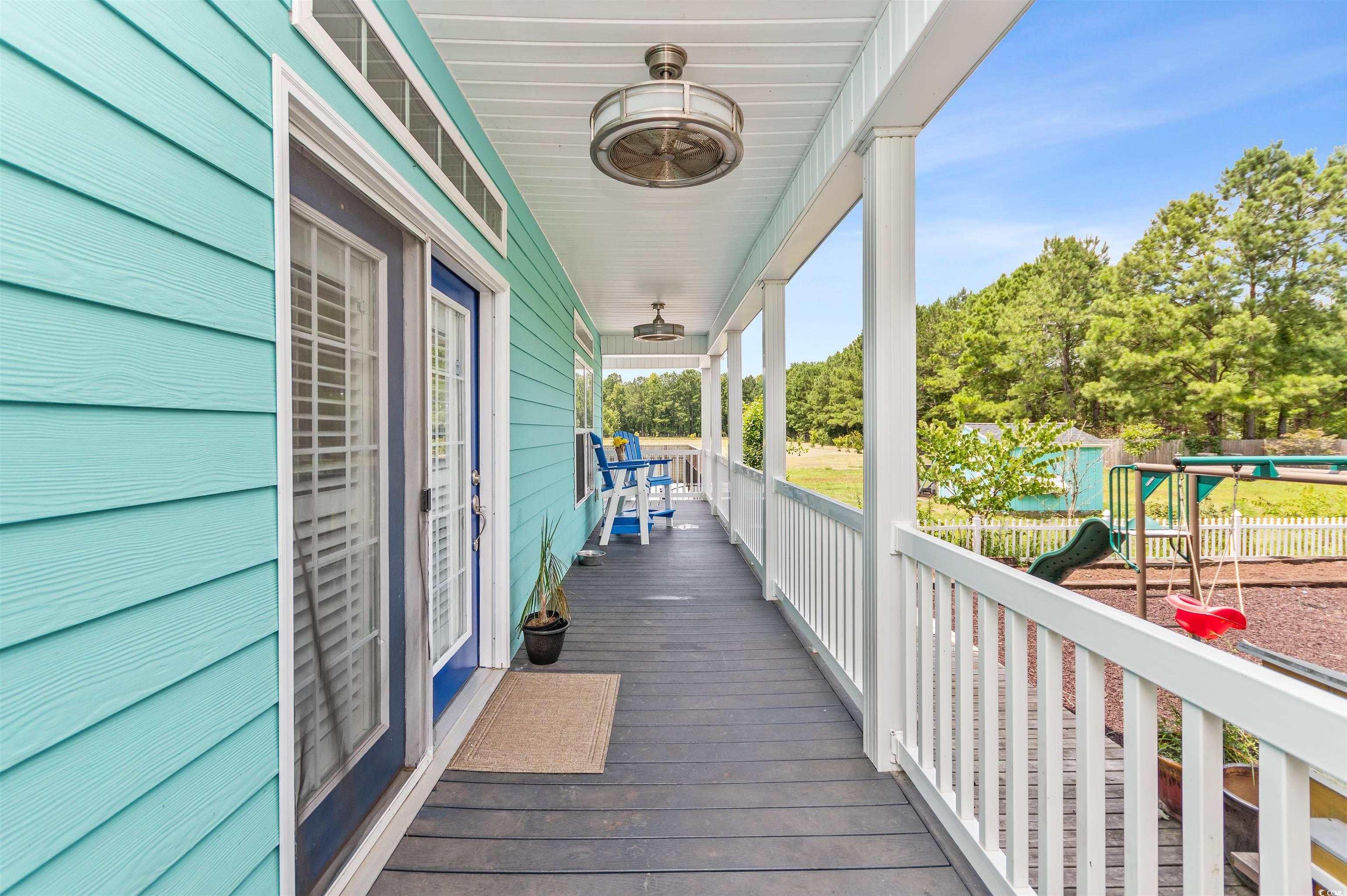 510 Council Bluff Road Longs, SC 29568 - Photo 39 of 40 Wooden terrace with covered porch