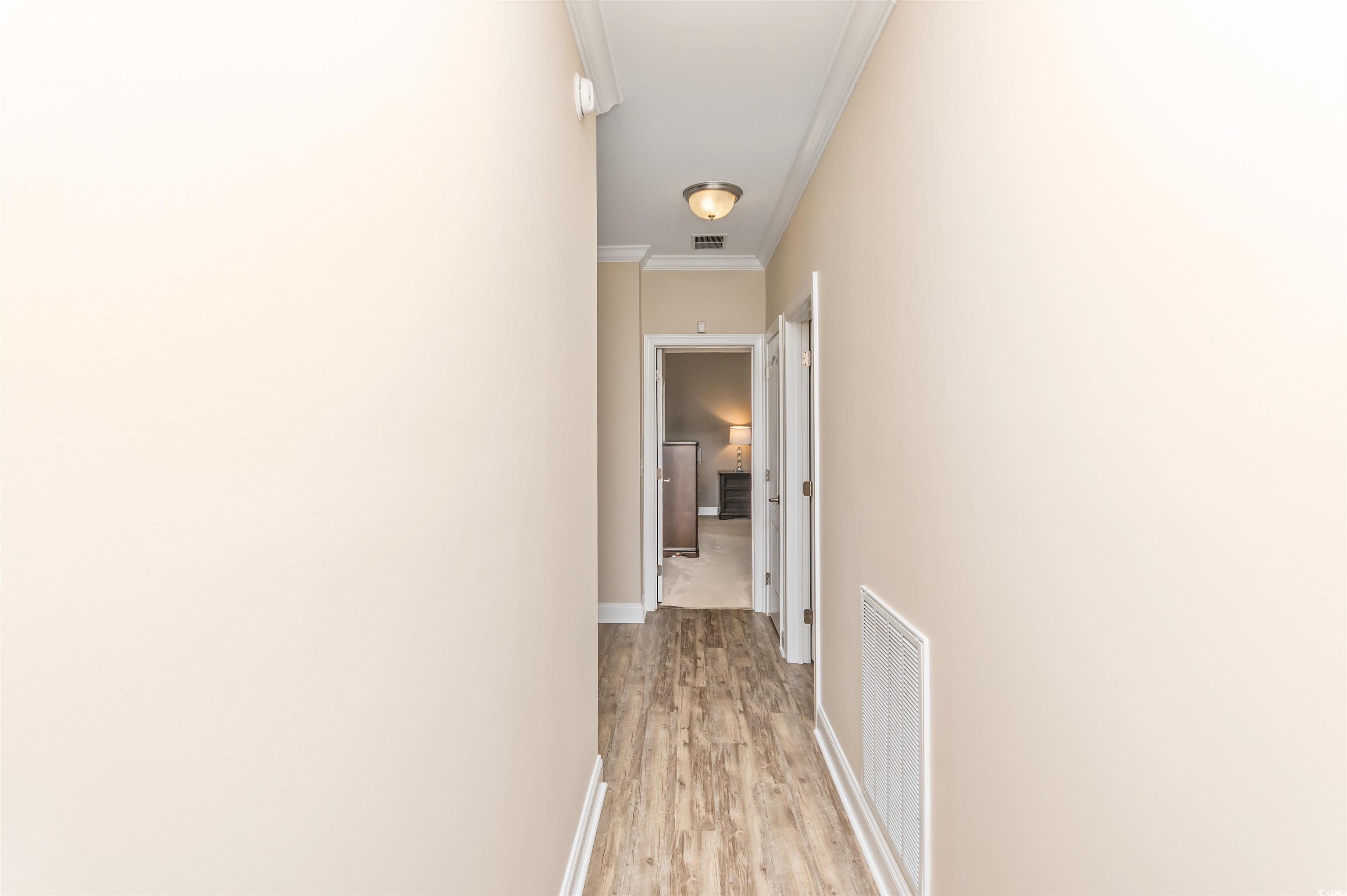 510 Council Bluff Road Longs, SC 29568 - Photo 4 of 40 Hallway featuring ornamental molding and light har