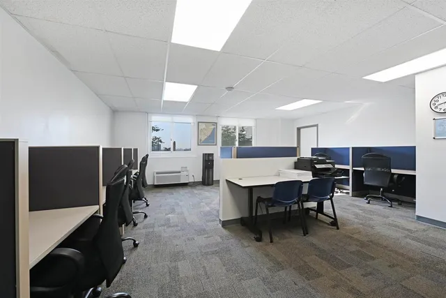 a living room with furniture a dining table and a piano table