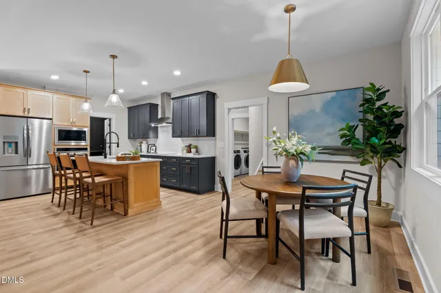 a kitchen with a refrigerator a stove a sink and a refrigerator