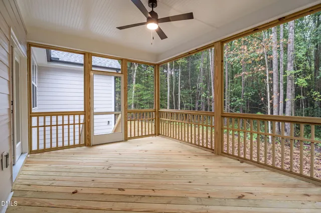 a front view of a house with a yard table and chairs