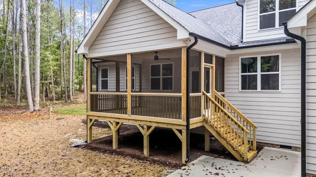 a view of house with a yard