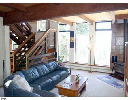 995 Wander Way Incline Village, NV 89451 - Photo 2 of 6 a living room with furniture a flat screen tv and a window
