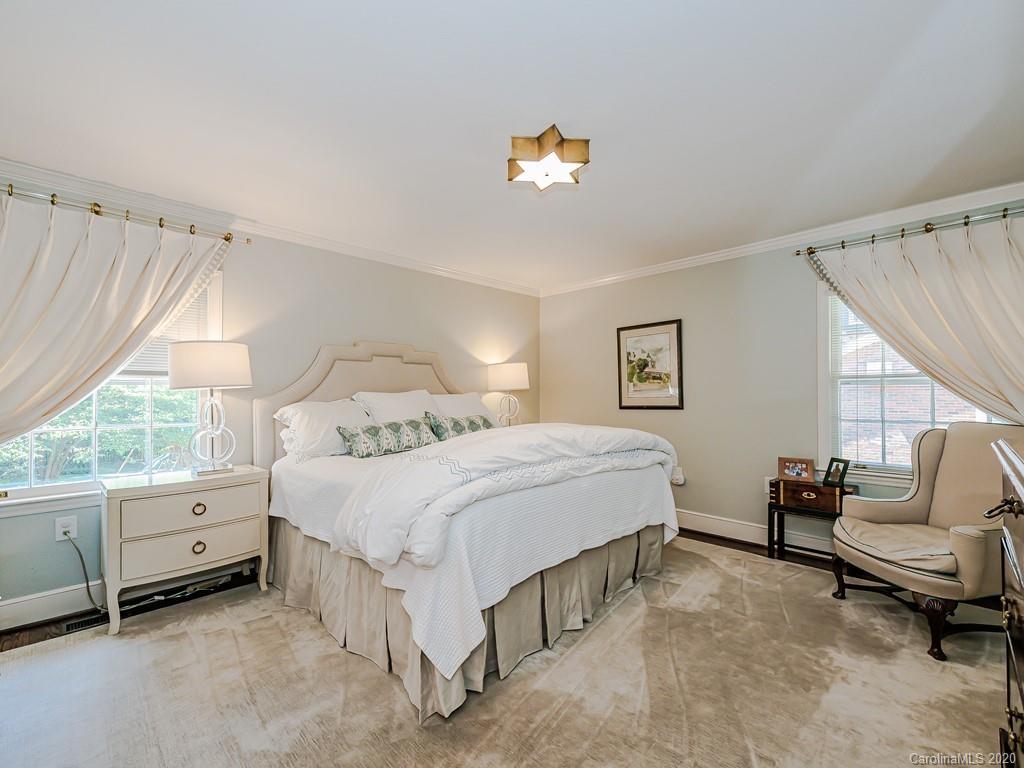 1927 Harris Road Charlotte, NC 28211 - Photo 22 of 48 a spacious bedroom with a bed and a window