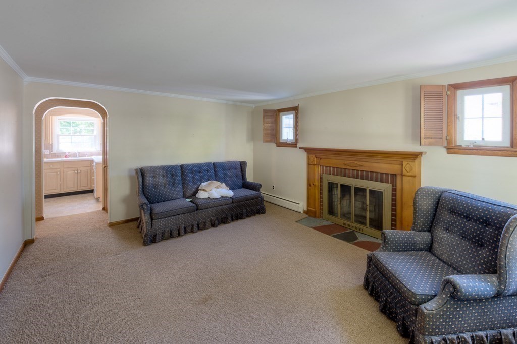 37 Endecott Street Springfield, MA 01118 - Photo 4 of 39 a living room with furniture and a fireplace