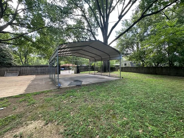 a backyard of a house with lots of green space