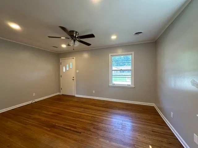 a view of an empty room with a window