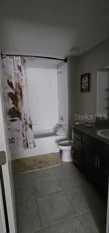 a bathroom with a bathtub sink and toilet