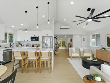 a large kitchen with a table and chairs