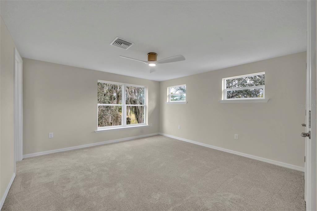 31201 Merry Road Tavares, FL 32778 - Photo 29 of 40 a view of an empty room with a window